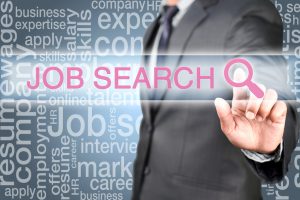 Man pointing into job search button on virtual screen